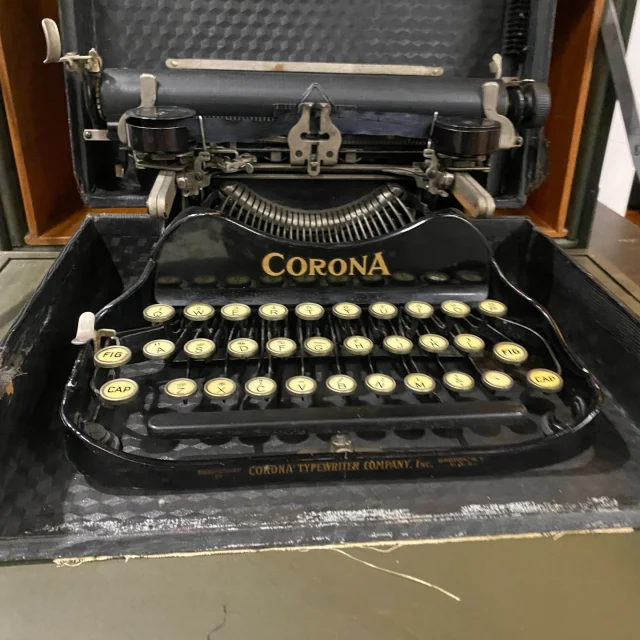 One of the many facets of chaplain’s ministry is writing letters to the families of soldiers. Whether providing comfort for the families of the fallen or rejoicing in the report of a new conversion, chaplains often had occasion to compose letters while in the field. As such, the advent of the portable typewriter was a great boon to field chaplains, who may have regularly found themselves without a proper desk at which to write. 

The Chaplains Museum recently acquired a Corona 3 portable typewriter manufactured by the Corona Typewriter Company of Groton, New York, from 1912 to 1941. This model was well-regarded for its compact size and light weight of only nine pounds! Furthermore, its aluminum and steel construction meant that it could take quite a beating from field usage. So effective was this model that the 1917 edition of Colonel James Moss’s Officers’ Manual specifically recommends that new officers acquire at least one when furnishing their offices. While we are not sure who used this specific typewriter, it is likely what military chaplains would have used in the era of the World Wars. It is currently displayed in our Service on the Homefront exhibit along with a World War II era field desk. 

To learn more about the tools chaplains used to aid them in their ministry, come visit the Chaplains Museum to see our growing collections! 

 

Help the Chaplains Museum expand our collection and add new exhibits! Look for the "Donate" section at the link in our bio.  

#chaplainsmuseum #chaplain #militarychaplain #libertyuniversity #typewriter #worldwari