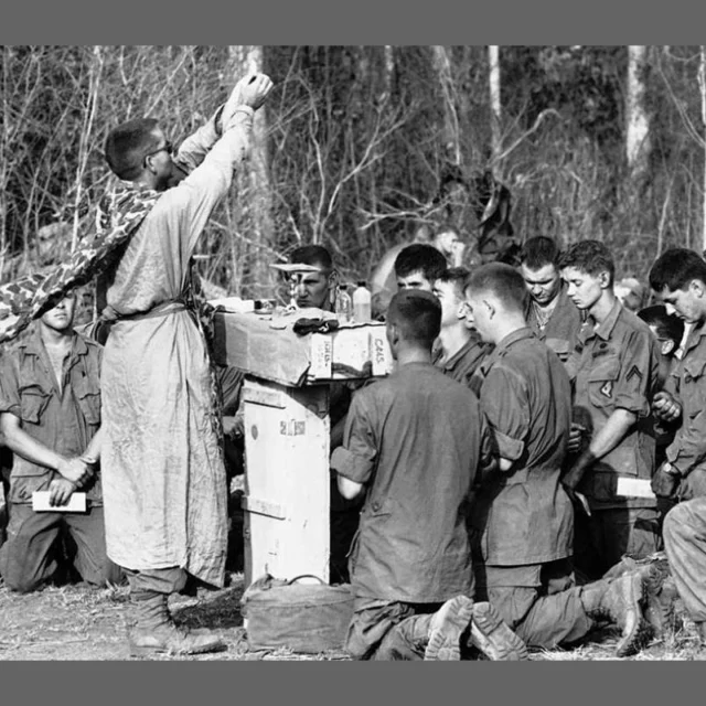 One defining feature of military chaplaincy is its noncombatant status. Chaplains serve unarmed, even in combat zones, a role shaped by international law and long tradition. The 1864 Geneva Convention formally recognized noncombatants, including religious personnel, and granted them protection under the laws of war. In return, chaplains are barred from taking part in combat, whether by carrying weapons or directing military action. 

Despite operating in dangerous conditions, and despite opponents who have sometimes ignored these rules, military chaplains have overwhelmingly upheld their commitment to their noncombatant status. From the Civil War to the present, chaplains like Father Francis Duffy and Medal of Honor recipient Chaplain Charles Watters ministered to troops under fire without bearing arms. 

Their service highlights a core component of chaplaincy: a ministry of presence, offering support, comfort, and presence where it is needed most. 

Image: Chaplain Charles Watters conducting a religious service in the field. 

#chaplainsmuseum #chaplain #militarychaplain #army